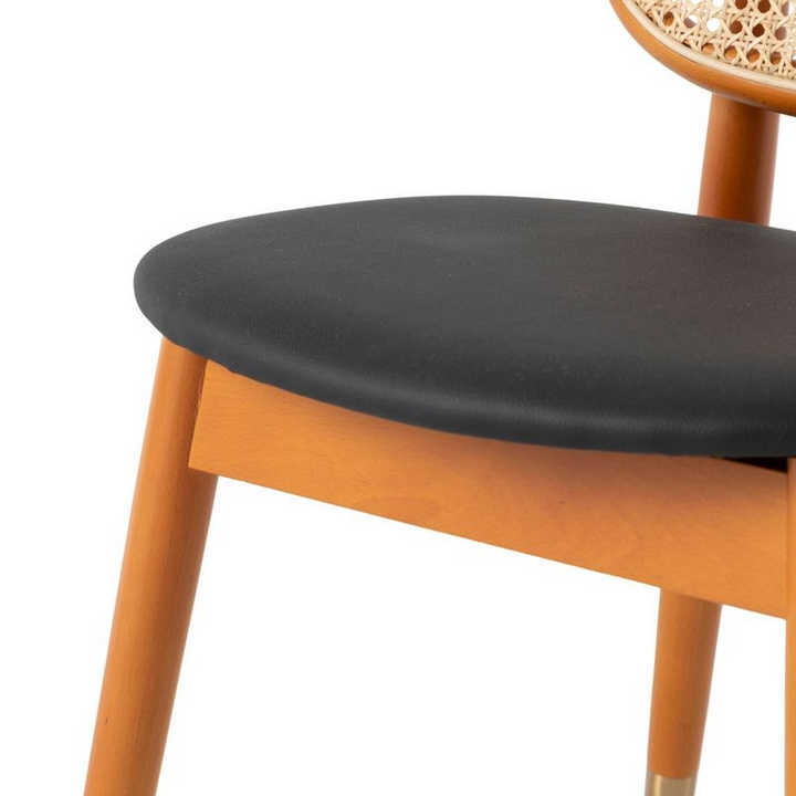 LeisureMod Holbeck Wicker Dining Chair with Upholstered Leather Seat and Beech Wood Legs Black Closeup.