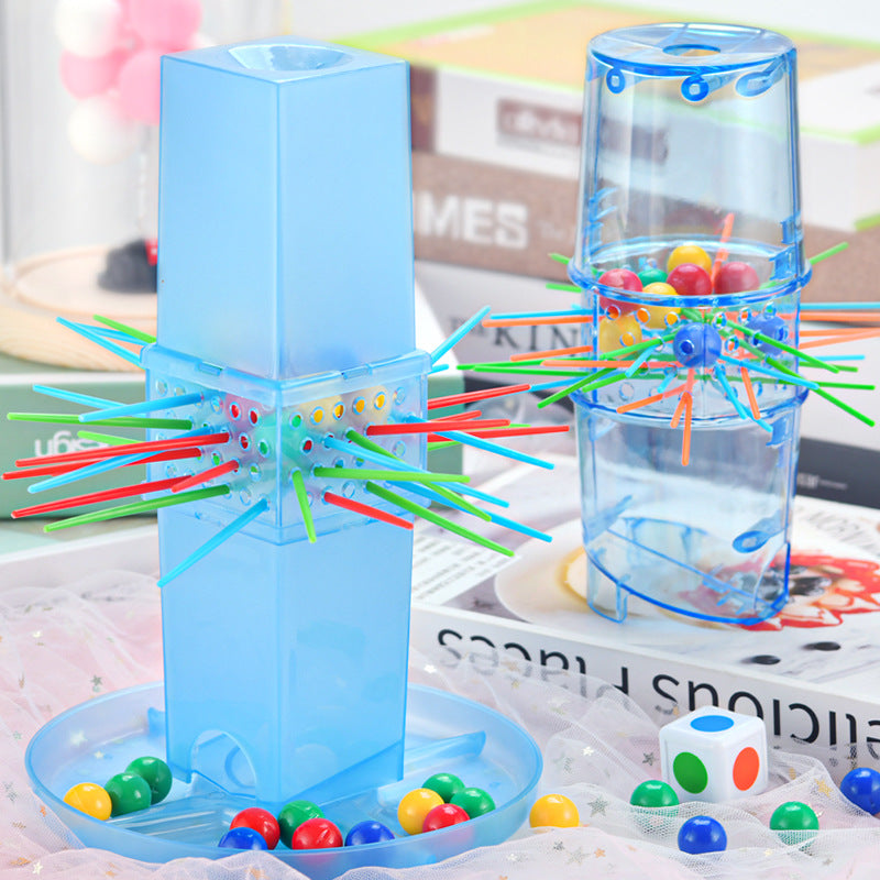 Colorful marble run toy with colorful balls on a magazine background.