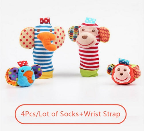 Set of colorful baby socks and wrist straps with cartoon designs on a white background.