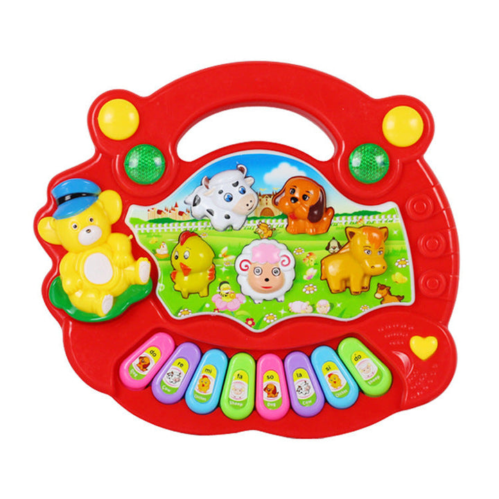 Children's toy piano with animal illustrations on a white background.