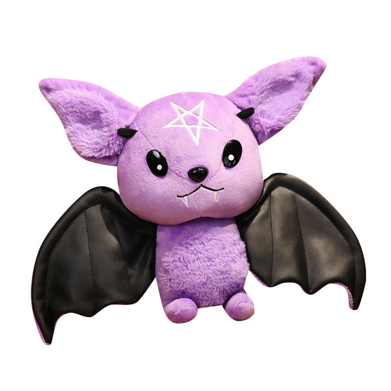 Purple plush bat toy with black wings on a white background.