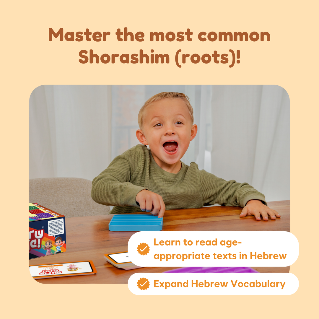 Child playing with educational Hebrew learning materials on a table.