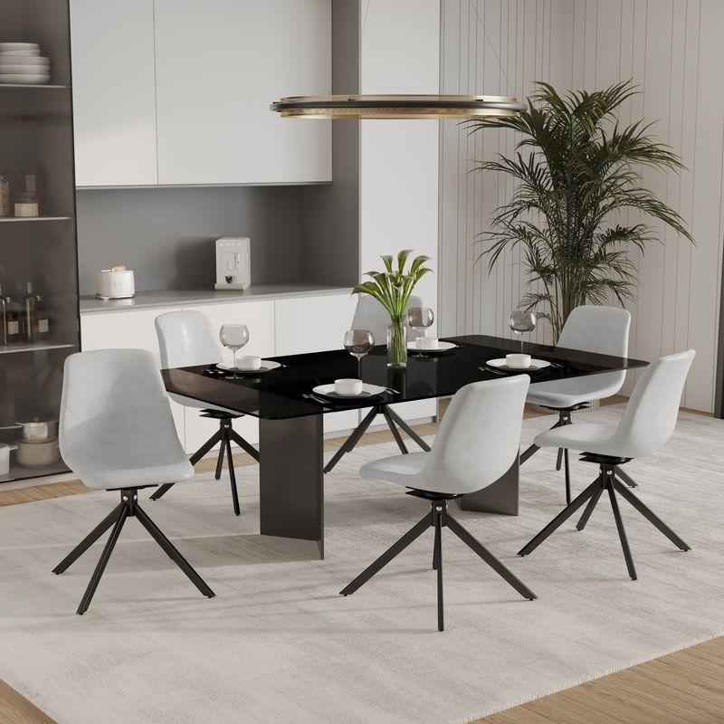 LeisureMod Markley Modern Leather Swivel Dining Chair with Metal Legs in Light Grey at Table.