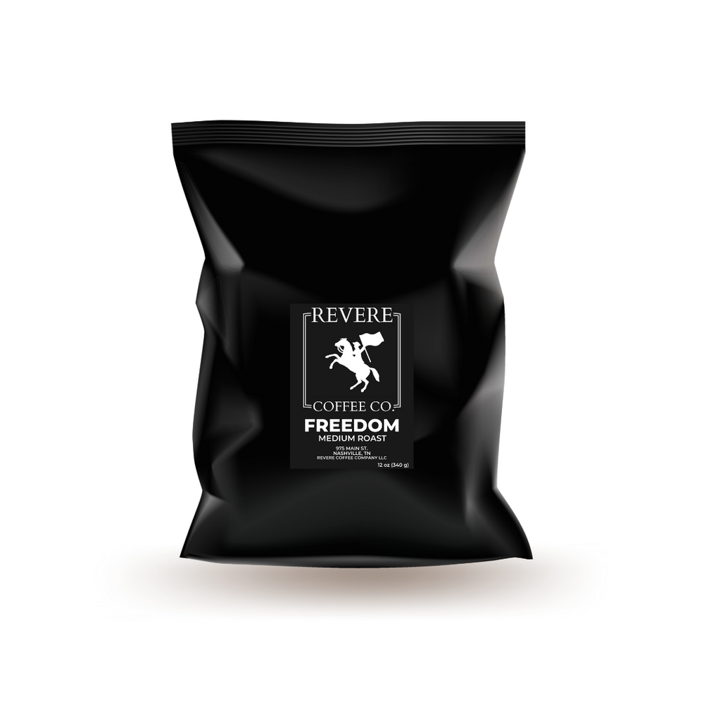Black coffee bag with Revere Coffee Co logo on a white background.