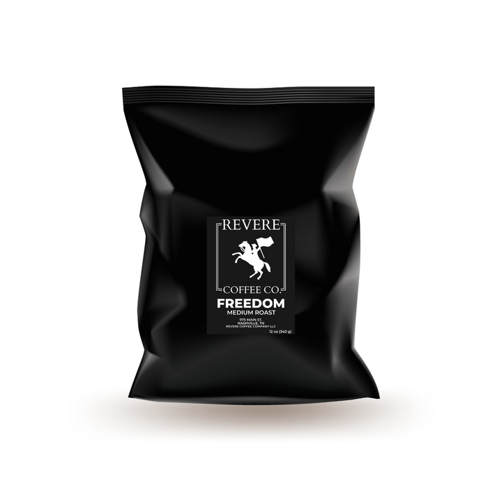 Black coffee bag with Revere Coffee Co logo on a white background.