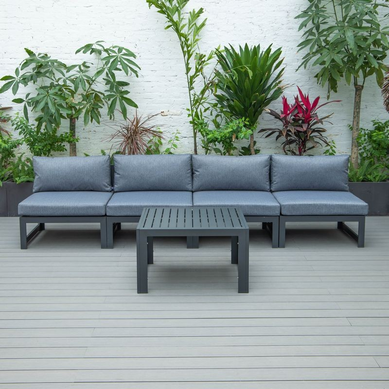 LeisureMod Chelsea 5-Piece Middle Patio Chairs and Coffee Table Set Black Aluminum with Cushions Blue on Deck.