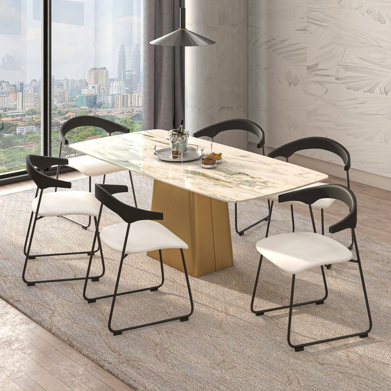 LeisureMod Lyra Collection Modern Chair in Black Back and White Seat at Table.