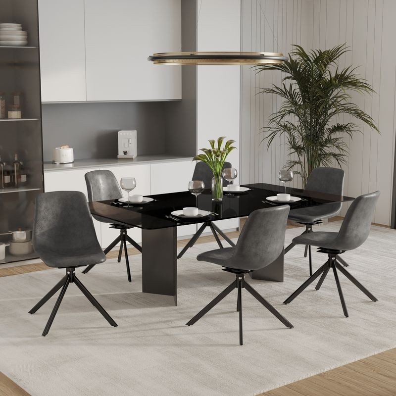 LeisureMod Markley Modern Leather Swivel Dining Chair with Metal Legs in Grey at Table.