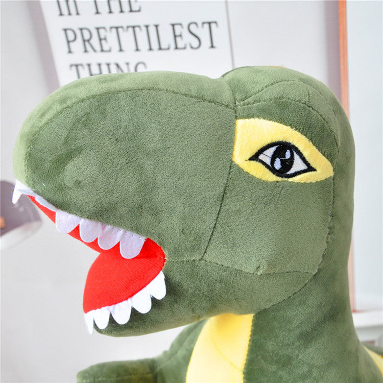 Close-up of a green dinosaur plush toy with a blurred background.