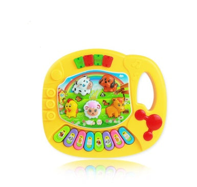 Colorful toy keyboard with animal illustrations on a white background.