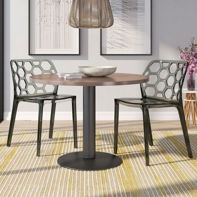 LeisureMod Modern Dynamic Dining Chair, Set of 2 Transparent Black at Table.