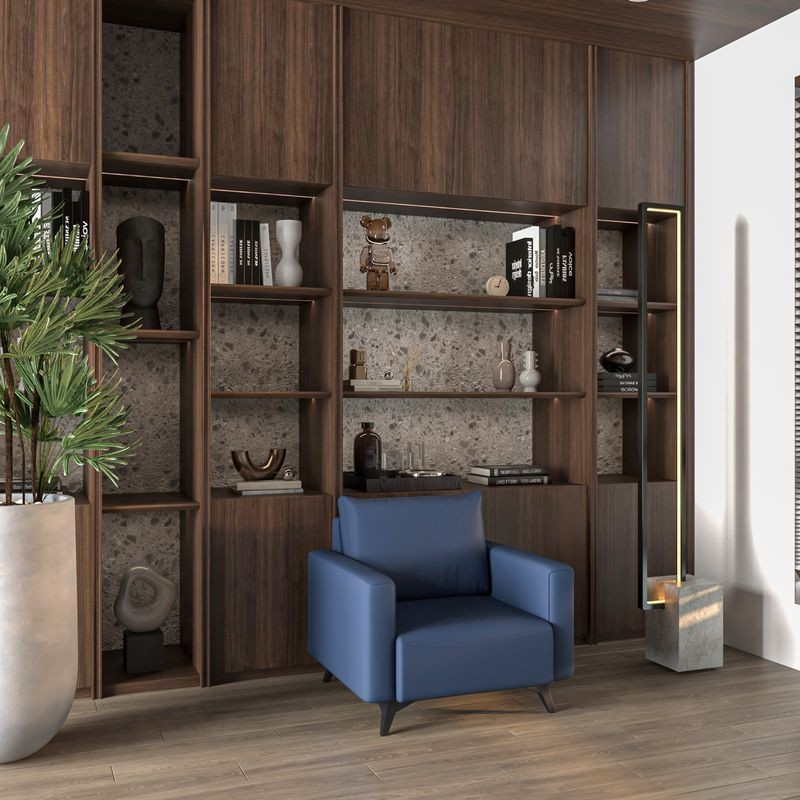 LeisureMod Inno Collection Single Seater Sofa in Dark Blue with Background.