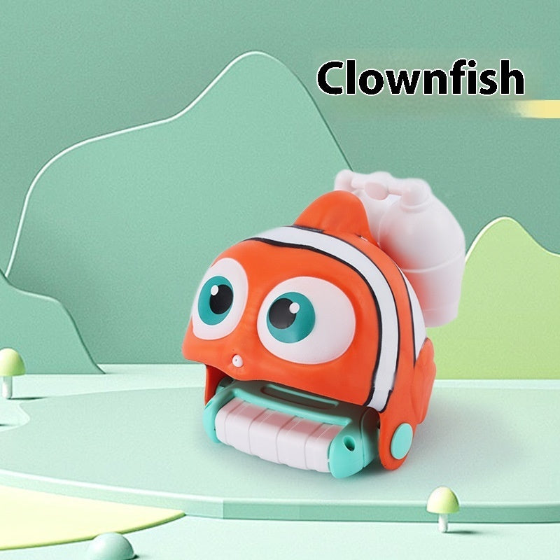 Toy clownfish with a green background.