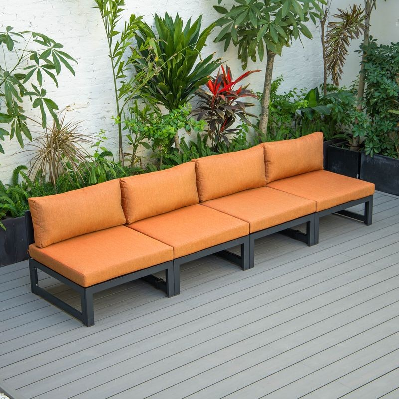 LeisureMod Chelsea 4-Piece Middle Patio Chairs Black Aluminum with Cushions Orange on Deck.