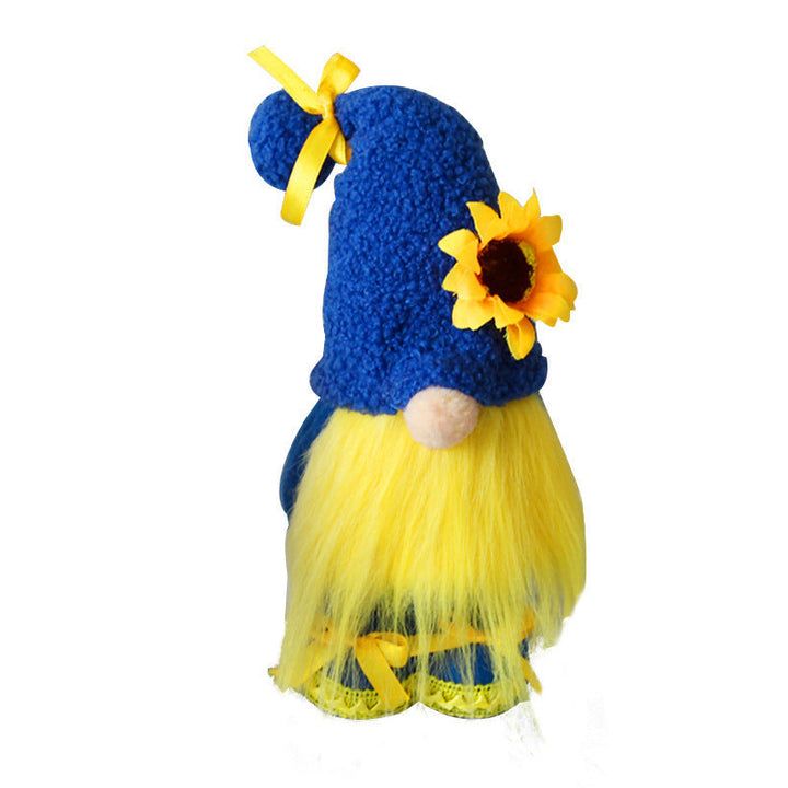 Gnome with blue hat and yellow outfit on a white background.