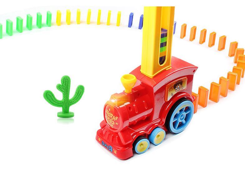Toy train with a yellow caboose on a white background.