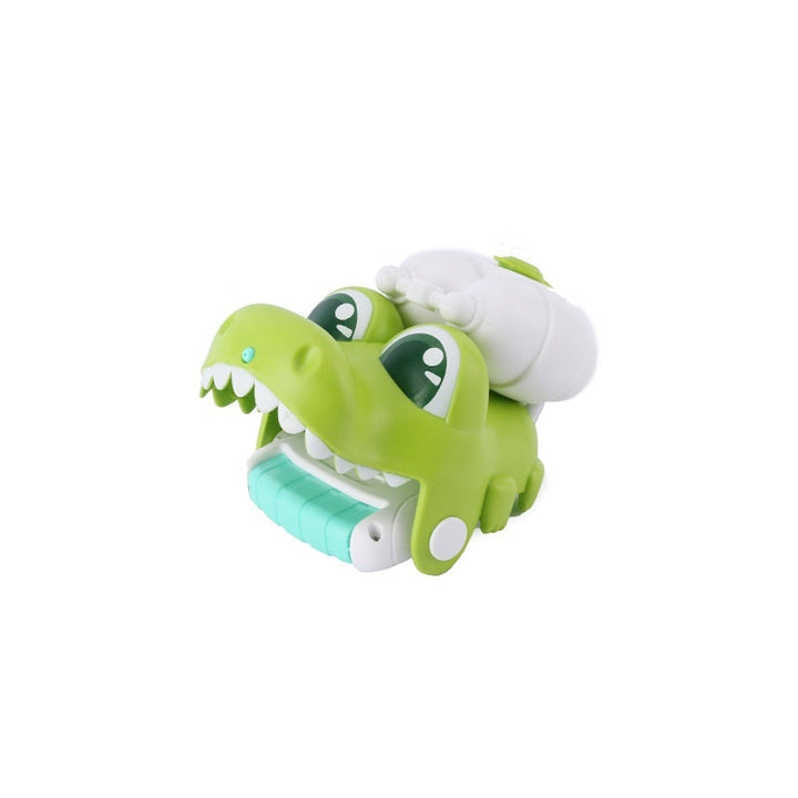 Green and white toy alligator on a white background.