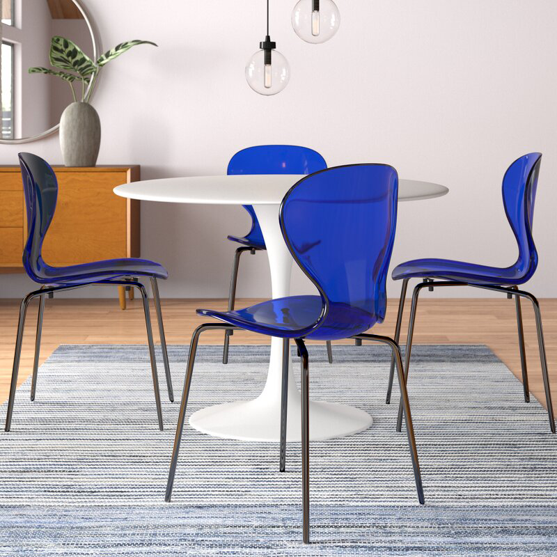 LeisureMod Modern Oyster Transparent Side Chair in Black Base set of 2 Blue at Table.