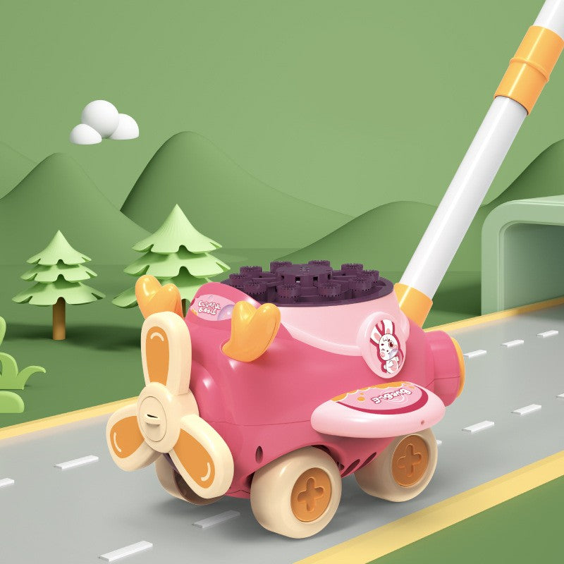 Toy on a road with a green landscape background.