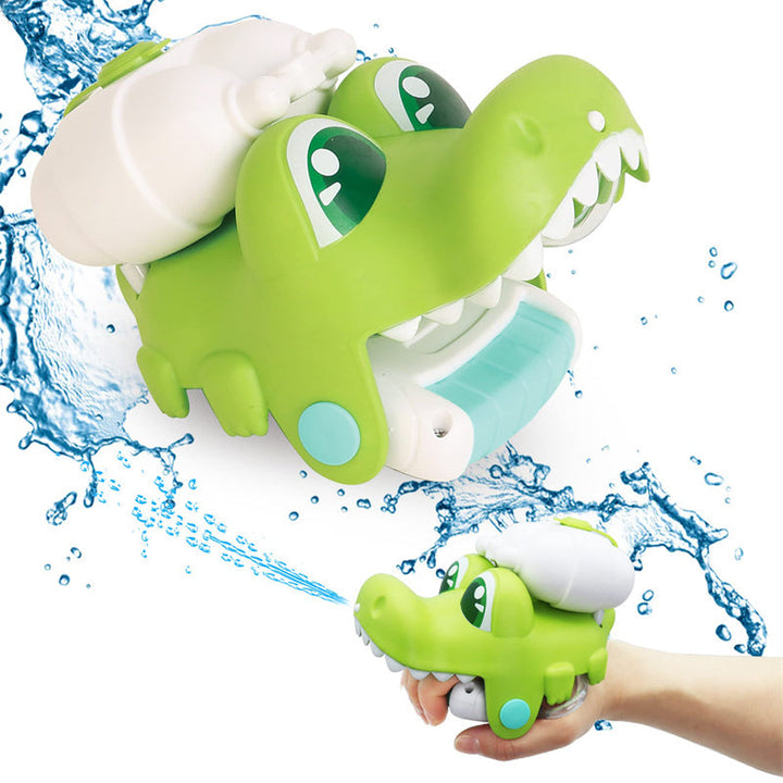Green dinosaur-shaped bath toy with water splashes on a white background.