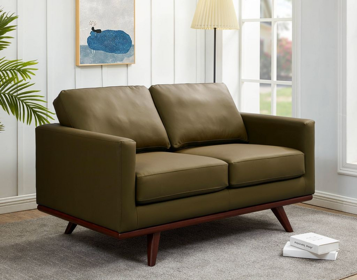 LeisureMod Chester Modern Faux Leather Loveseat Chair in Green Leather with Background.