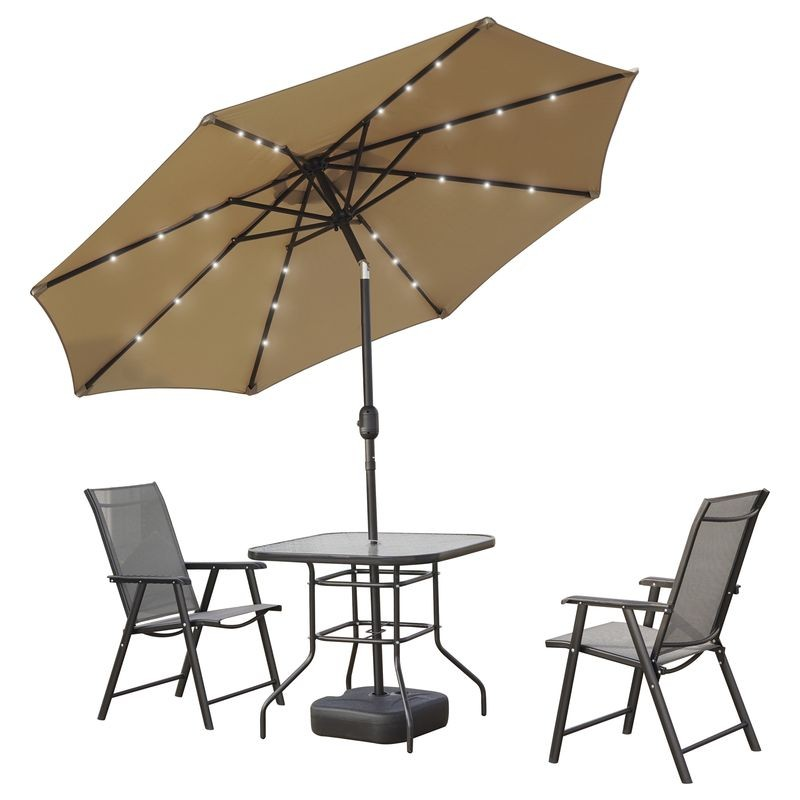 LeisureMod Sierra Outdoor Patio Umbrella with Base in Beige Tilted.