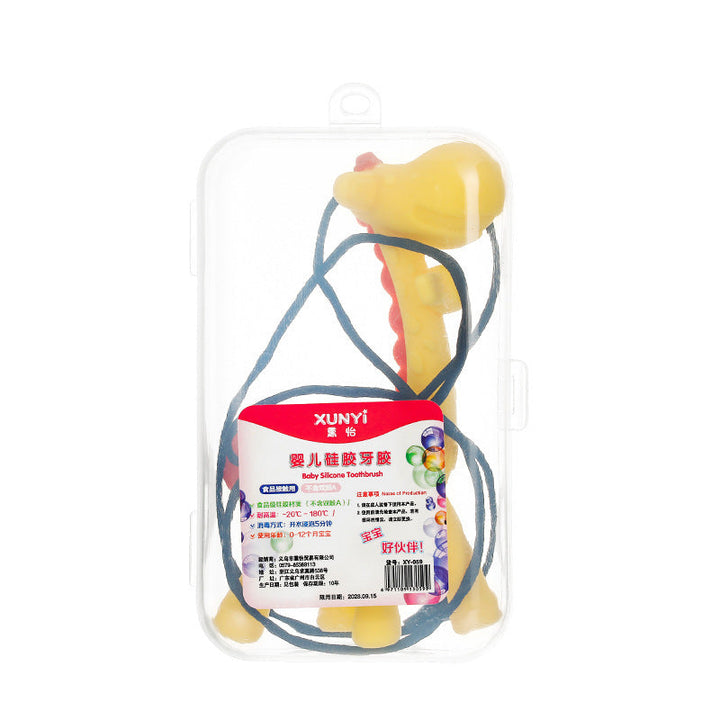 Baby silicone toothbrush with packaging on a white background.
