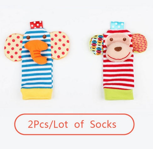 Two colorful monkey-themed socks with cartoon faces on a white background.