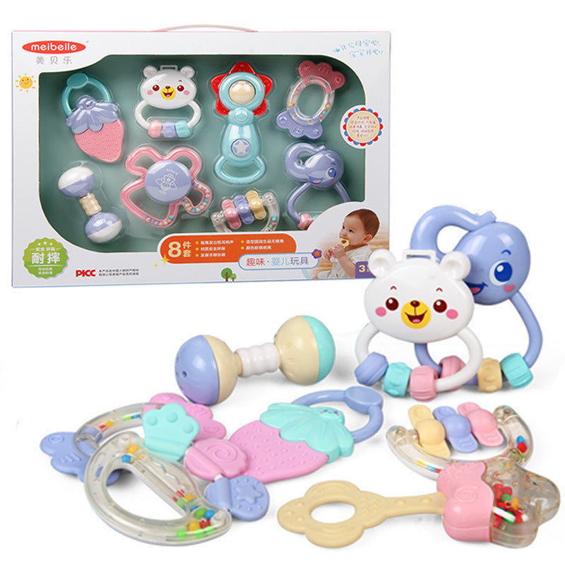 Set of colorful baby toys with packaging on a white background.