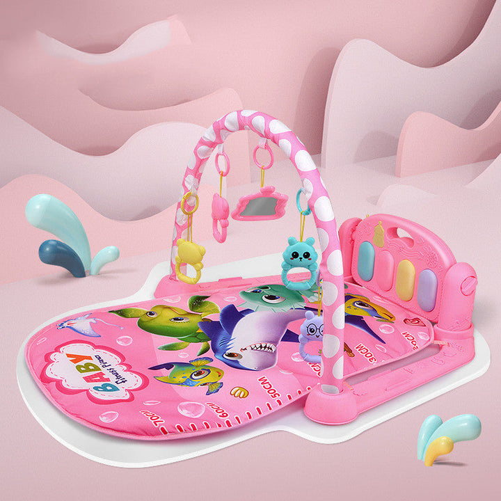 Pink baby gym with toys on a pink background.