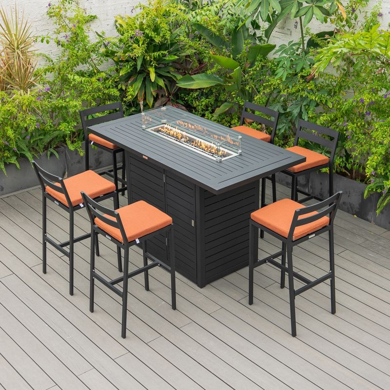 LeisureMod Chelsea Collection Modern Aluminum Outdoor Bar Chair in black with Orange Cushions at Table.
