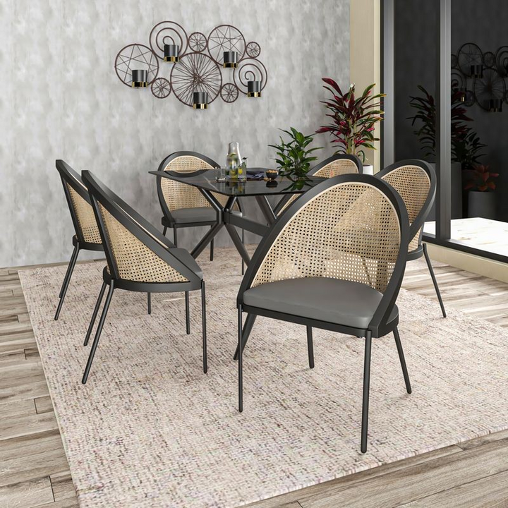 LeisureMod Urbane Collection Modern Dining Chair with Wicker Back in Charcoal at Table.