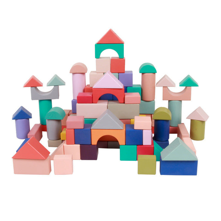 Colorful wooden building blocks on a white background.