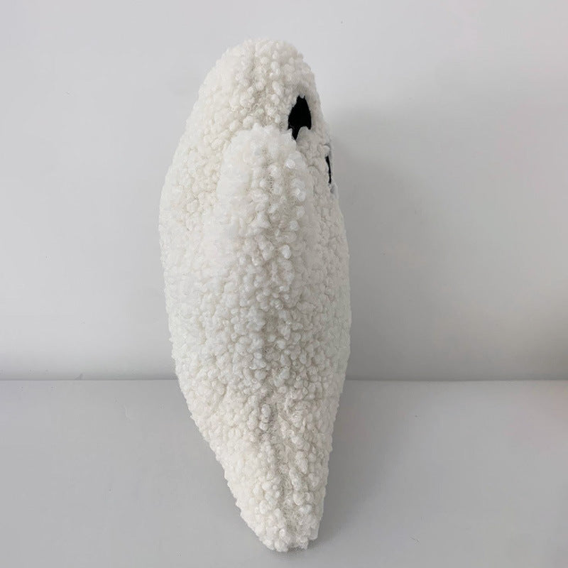 White textured pillow on a light gray background.