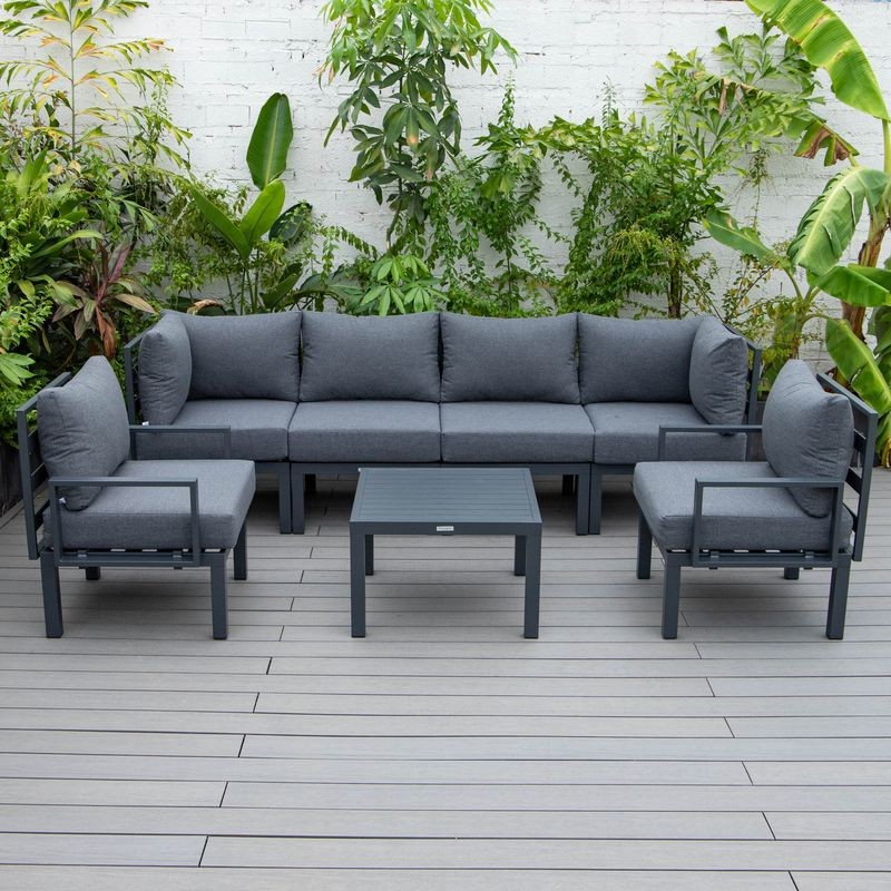 LeisureMod Chelsea 7-Piece Patio Sectional and Coffee Table Set Black Aluminum with Cushions Black Photo.