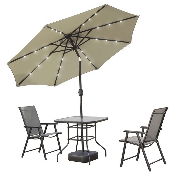 LeisureMod Sierra Outdoor Patio Umbrella with Base in Cream Tilted.