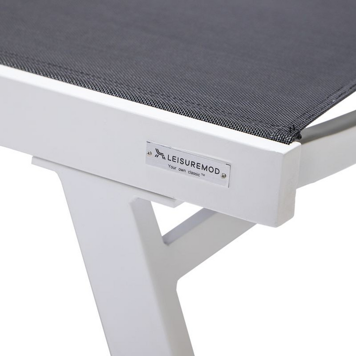 LeisureMod Marlin Patio Chaise Lounge Chair with Armrests in White Aluminum Frame Black Closeup.
