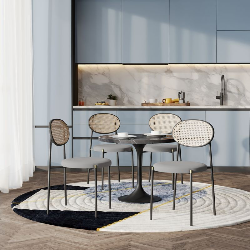 LeisureMod 5-Piece Dining Set with 36" Round Dining Table Black Sintered Stone Top and Black Pedestal with 4 Velvet Dining Chairs in Black Steel Legs in Grey in Room.