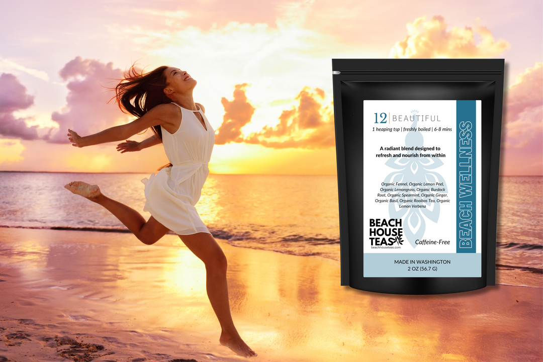 Woman in a white dress jumping on a beach with a package of Beach House Teas in the foreground.