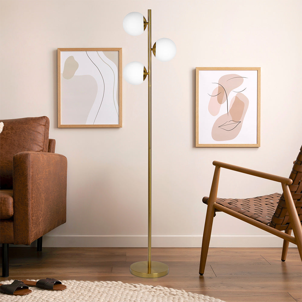 Brilliance Modern Gold Brush Floor Lamp, Opal Glass Shades and Round Metal Base in Room.