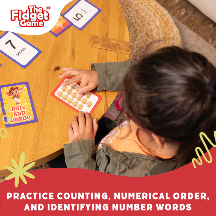 Child playing the fidget game with cards on a wooden table.