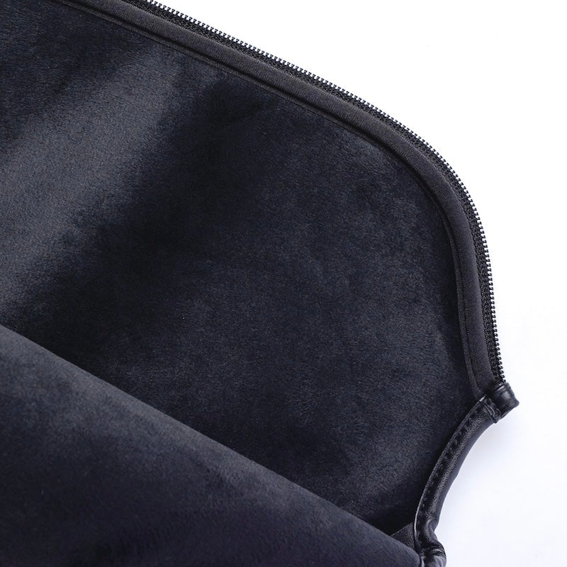 Close-up of a black zippered pouch on a white background.
