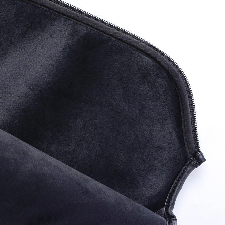 Close-up of a black zippered pouch on a white background.