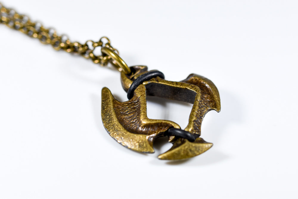 Pendant 12mm d6 Axe Blade w/ Old Brass Finish