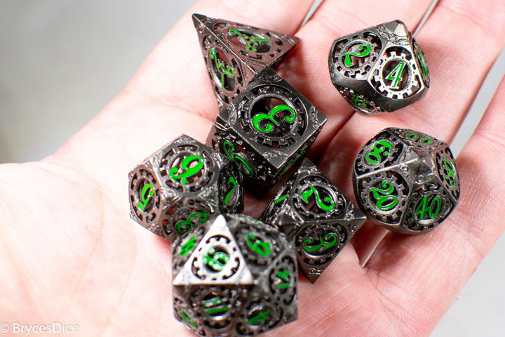 Gun Metal Hollow Gear Dice with Green Numbers 7-Dice Set