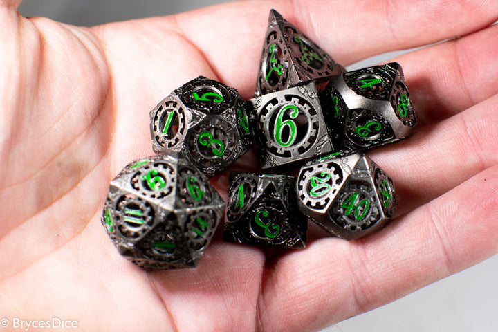 Gun Metal Hollow Gear Dice with Green Numbers 7-Dice Set