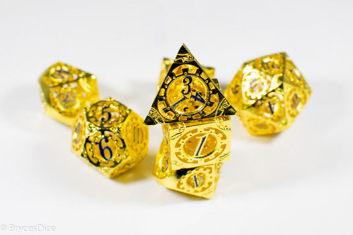 Gold Metal Hollow Gear Dice with Blue Numbers 7-Dice Set