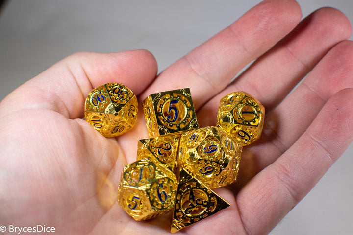 Gold Metal Hollow Gear Dice with Blue Numbers 7-Dice Set