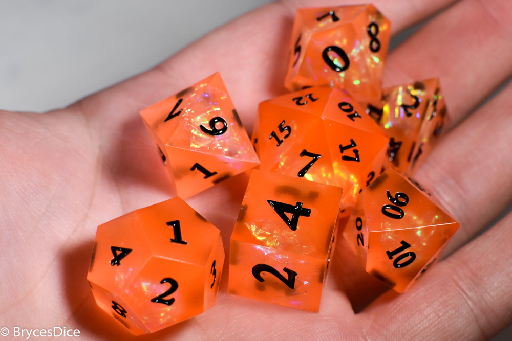 Orangetober Sharp Edge Resin 7-Dice Dice (Orange w/ Black Numbers)
