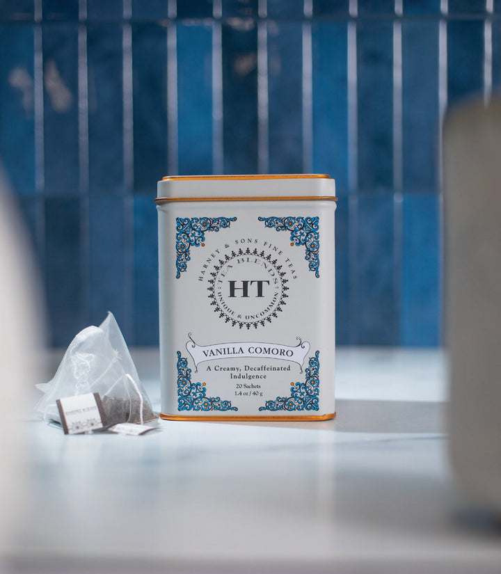 HT Vanilla Comoro tea canister on a surface with a blue tiled background